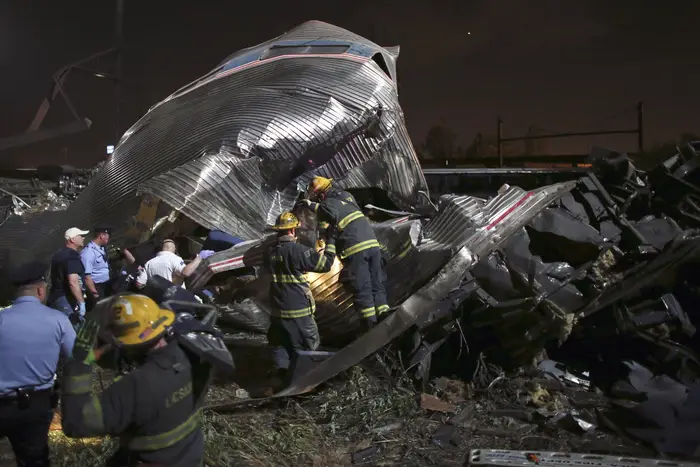 First responders look at the wreckage (AP)